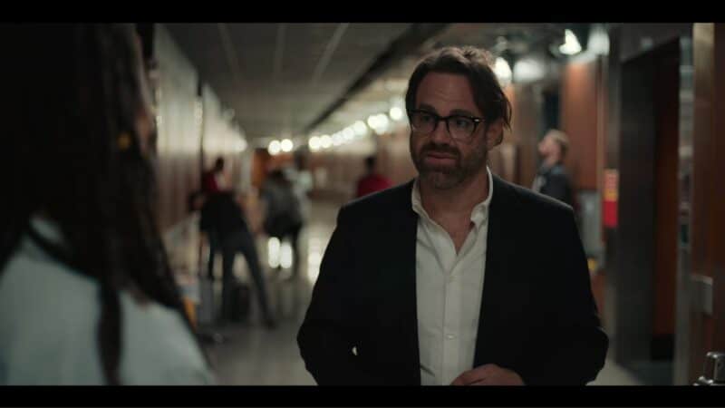 Todd (Paul Adelstein) having a conversation in the hall