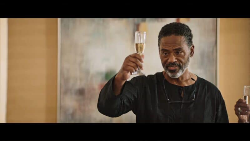 Garvin (Richard Lawson) giving a toast
