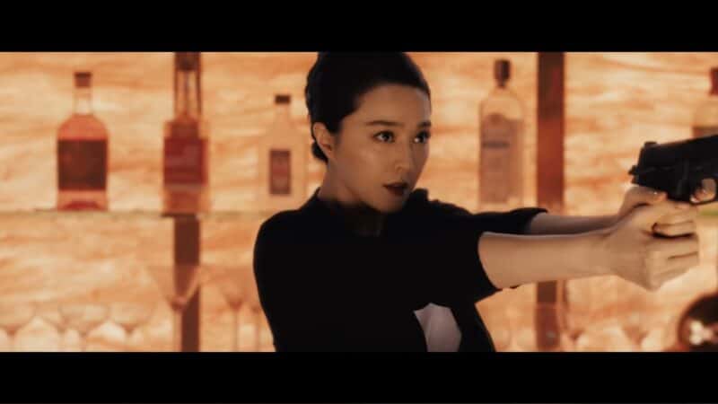 Lin Mi (Bingbing Fan) with a gun in hand