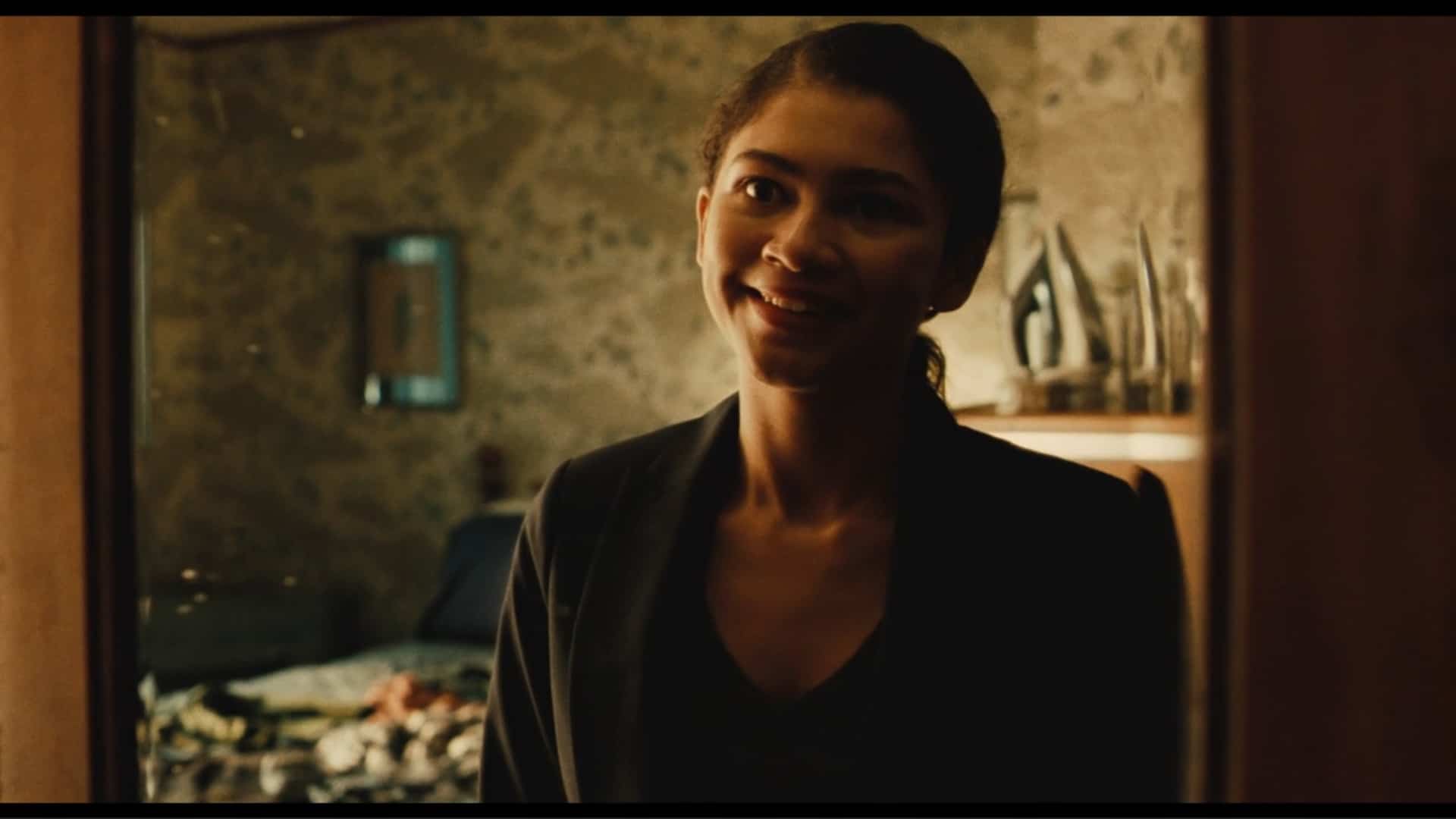 Rue smiling, in a creepy way