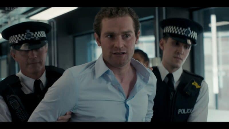 Saul (Mark Stanley) getting arrested