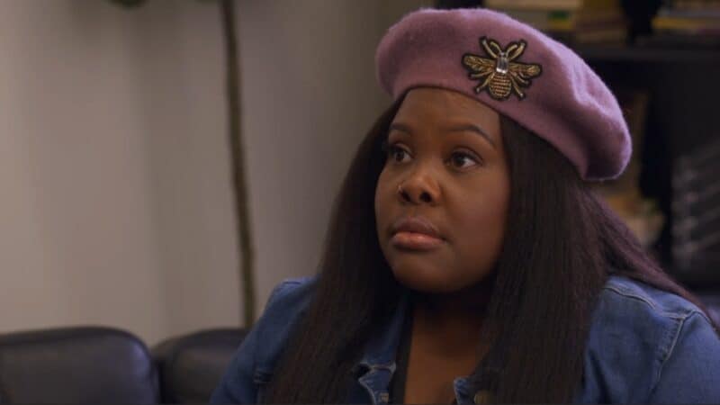 Simone (Amber Riley) when first hired to be Monica's assistant
