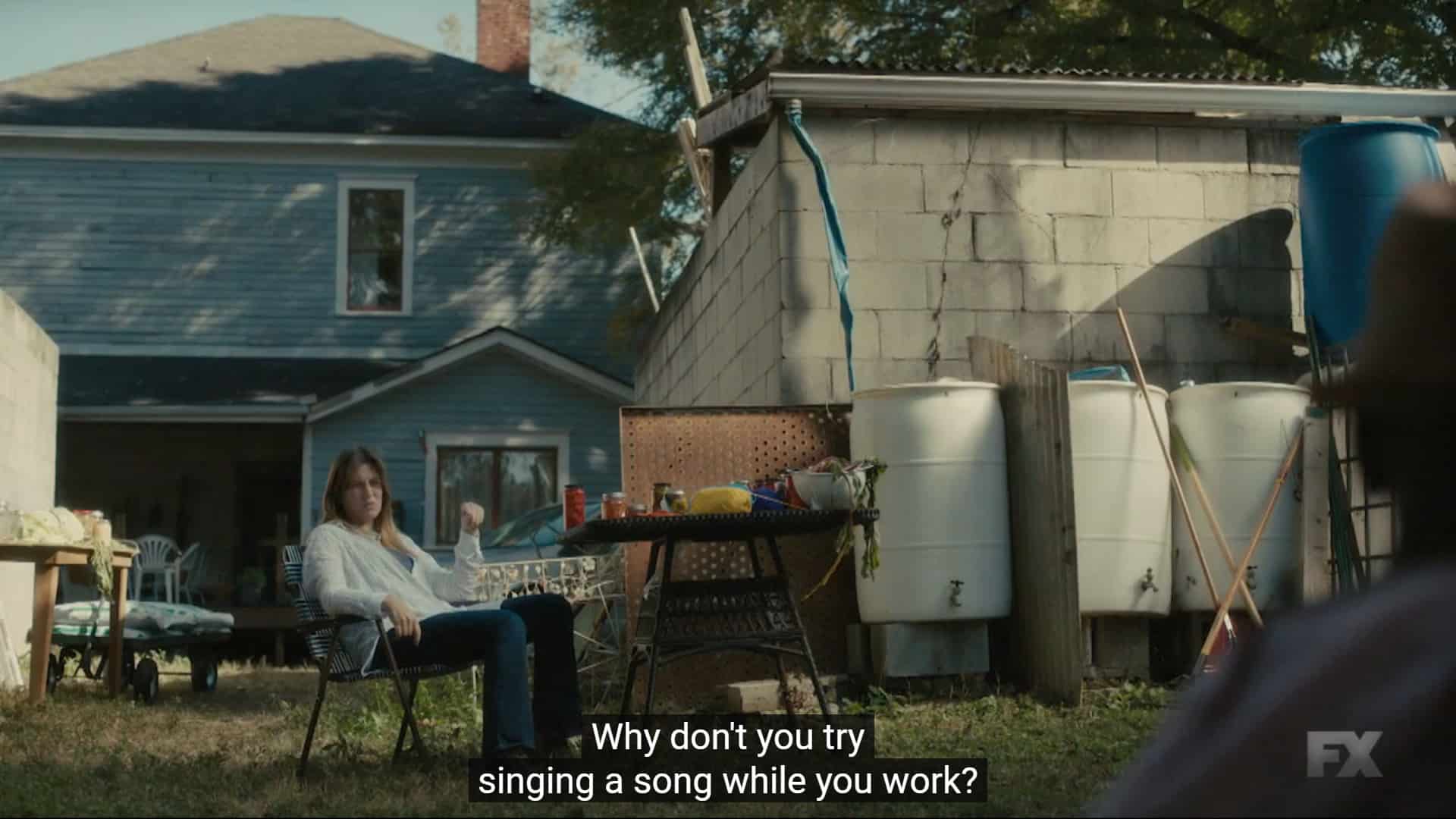 Amber (Laura Dreyfuss) telling the kids to sing while they work