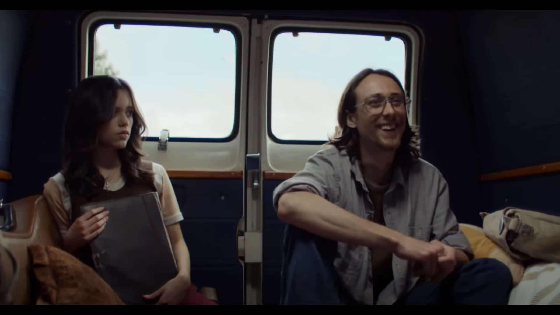 Lorraine (Jenna Ortega) and RJ (Owen Campbell) in the back of Wayne's van