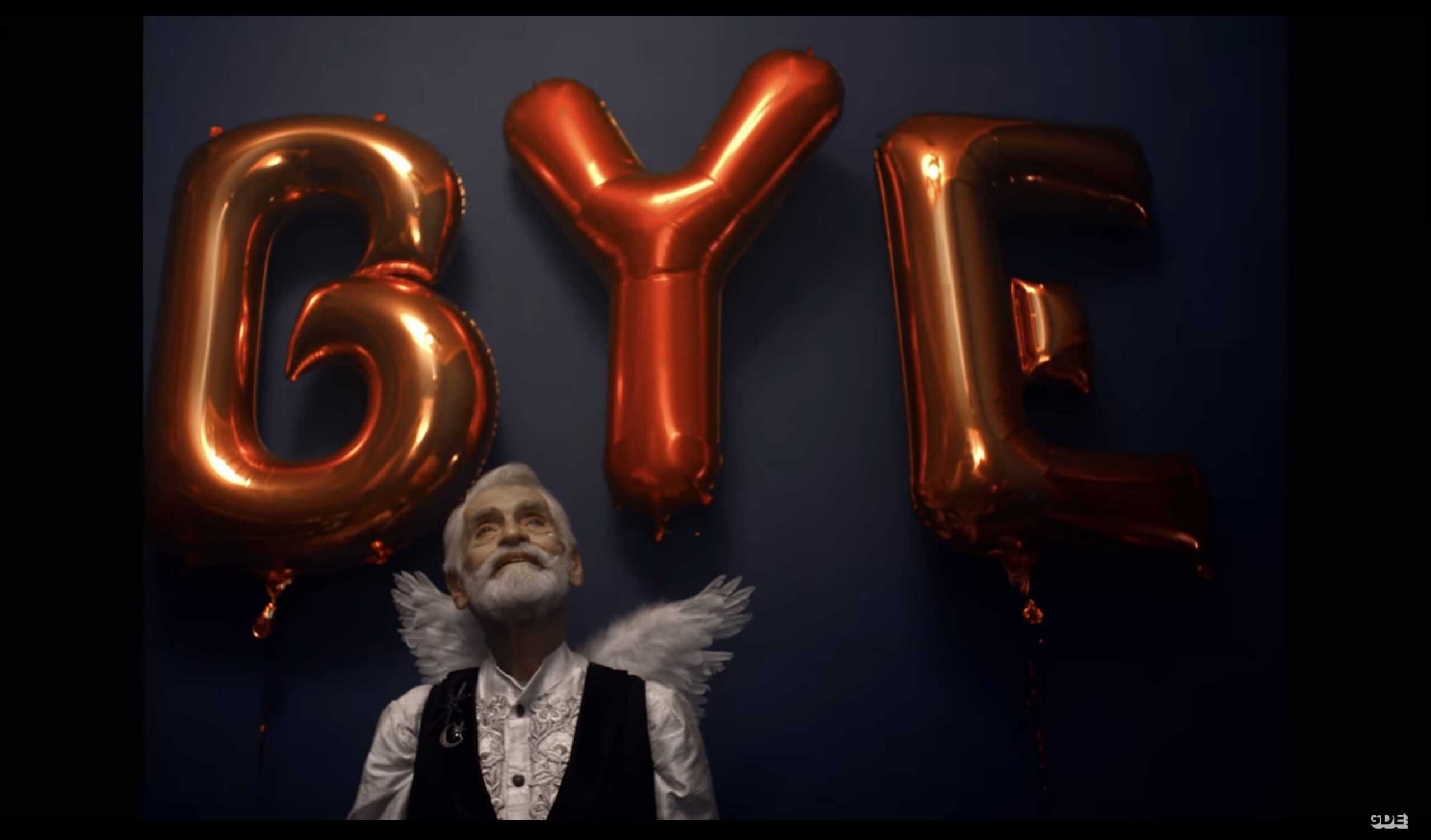 Moon Manor Jimmy (James "Jimmy" Carrozo) in front of balloons which spell out "Bye"