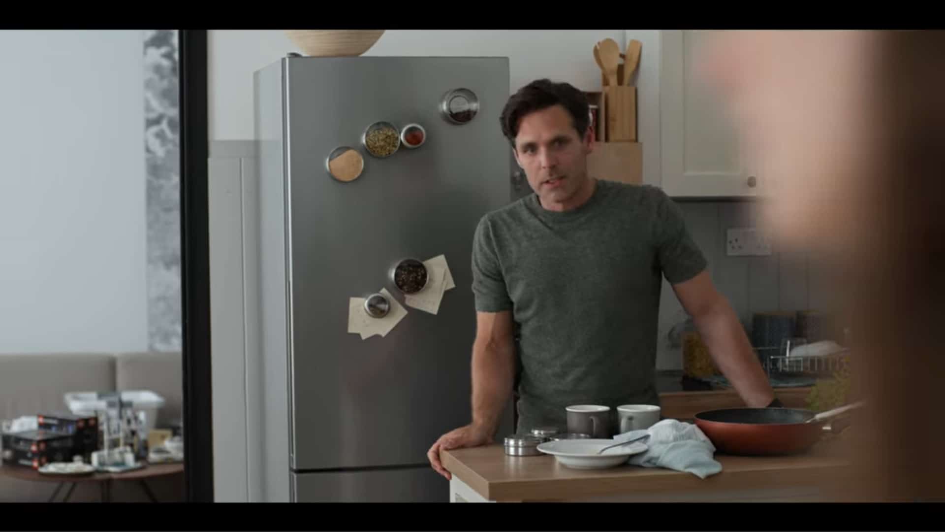 Rob (Luke Norris) in a kitchen, talking to Beth