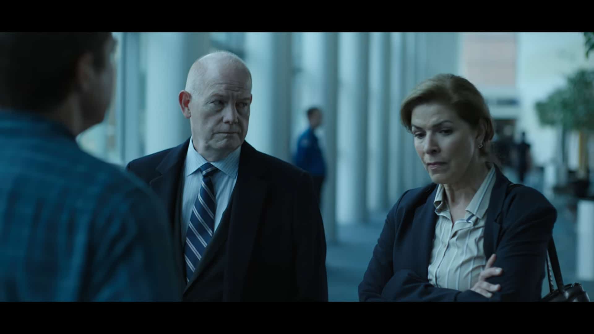Agent Graves (Glenn Morshower) and Agent Clay (Tess Malis Kincaid) talking with each other and Marty about how to make a deal regarding Omar and Javi