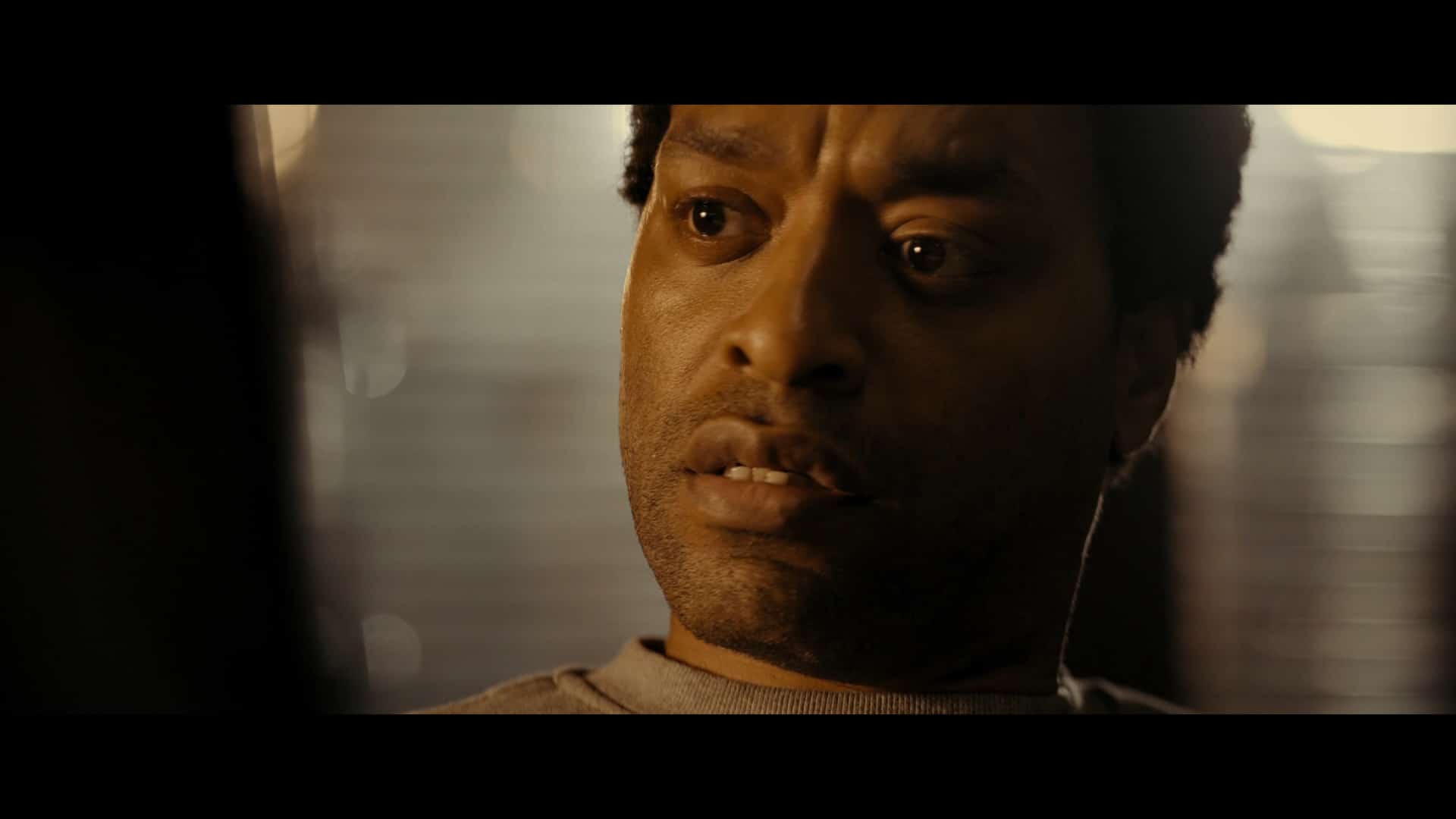 K. Faraday (Chiwetel Ejiofor) learning about English