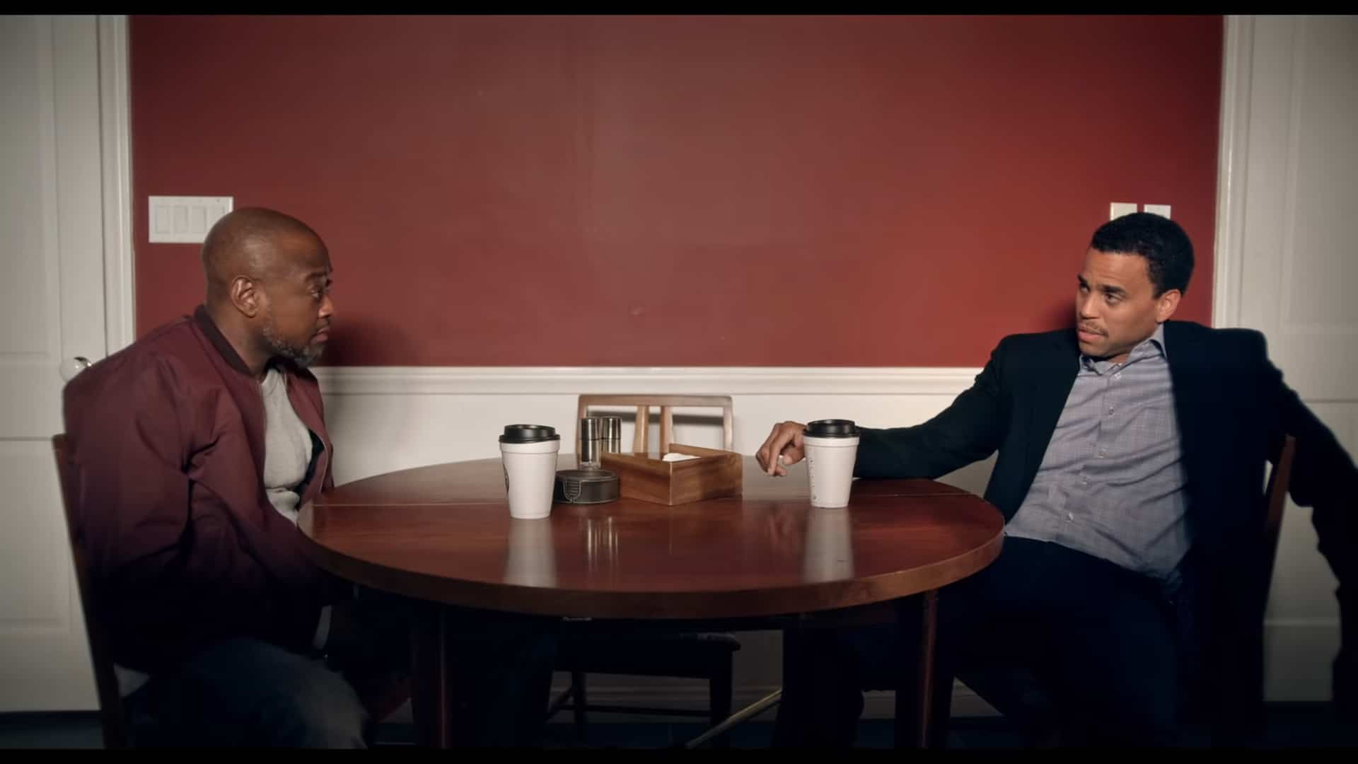 Marcus (Omar Epps) and Joe (Michael Ealy) talking over coffee | Marcus Omar Epps and Joe Michael Ealy The Devil You Know 2022 Marcus (Omar Epps) and Joe (Michael Ealy) talking over coffee