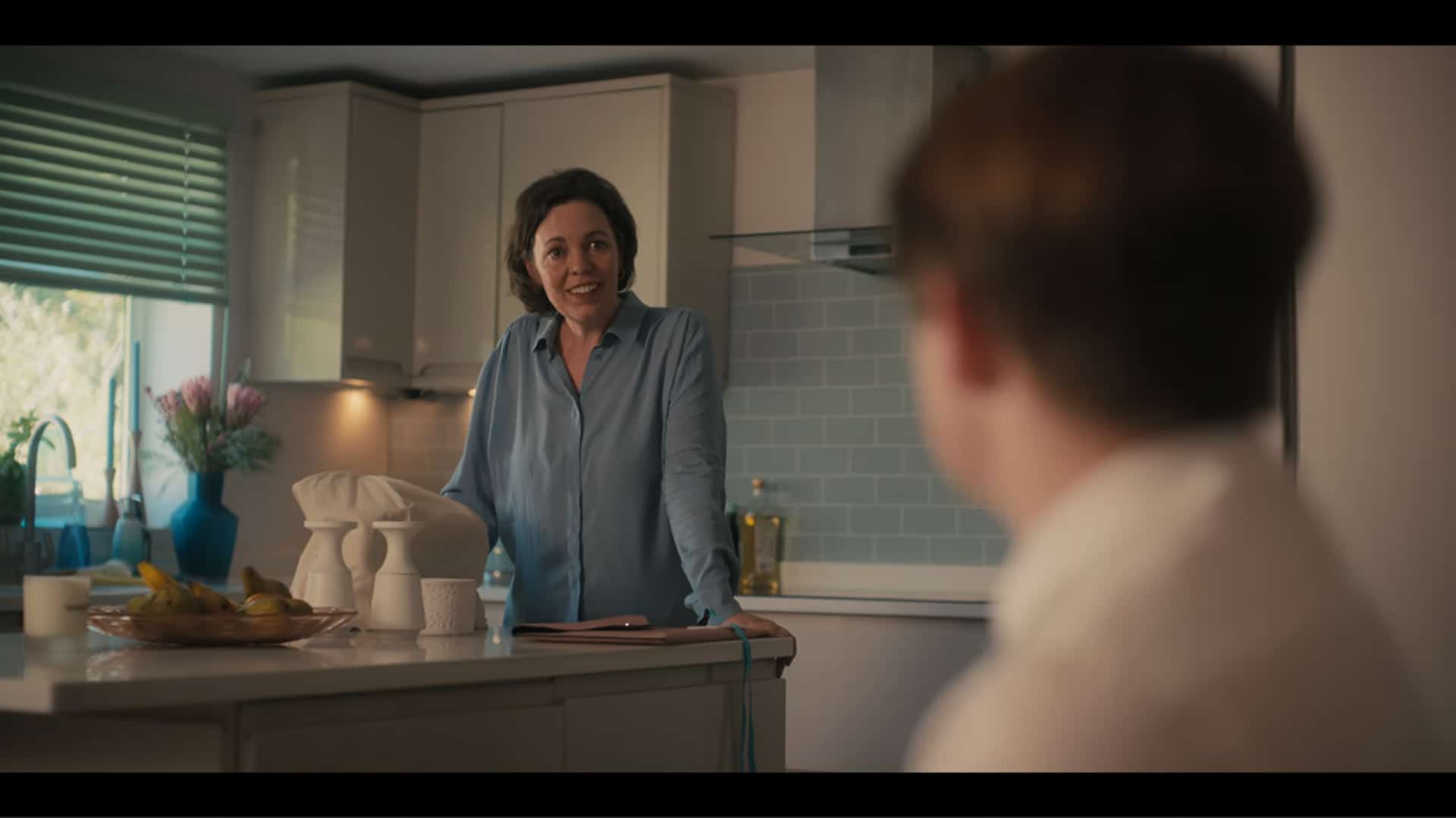 Nick's Mom (Olivia Colman) talking to her son about Imogen