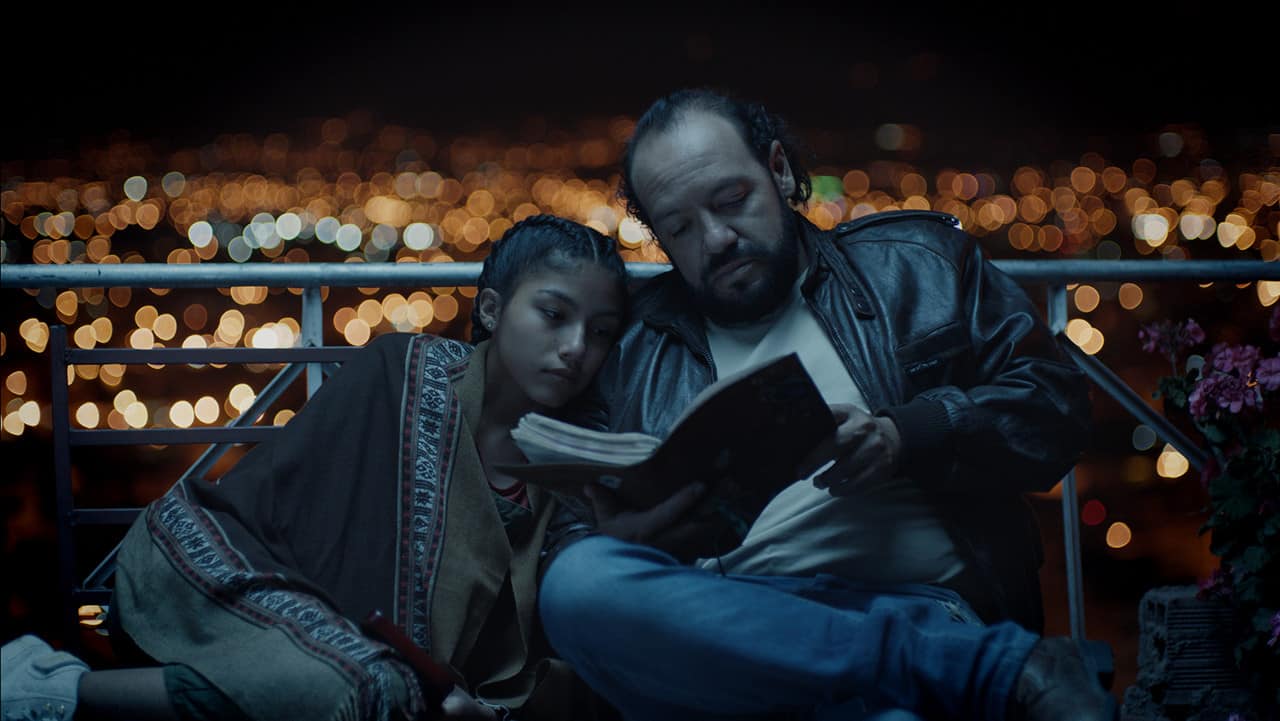 Aleida (Svet Mena) and Humberto (Enrique Araoz) reading Aleida's mom's diary