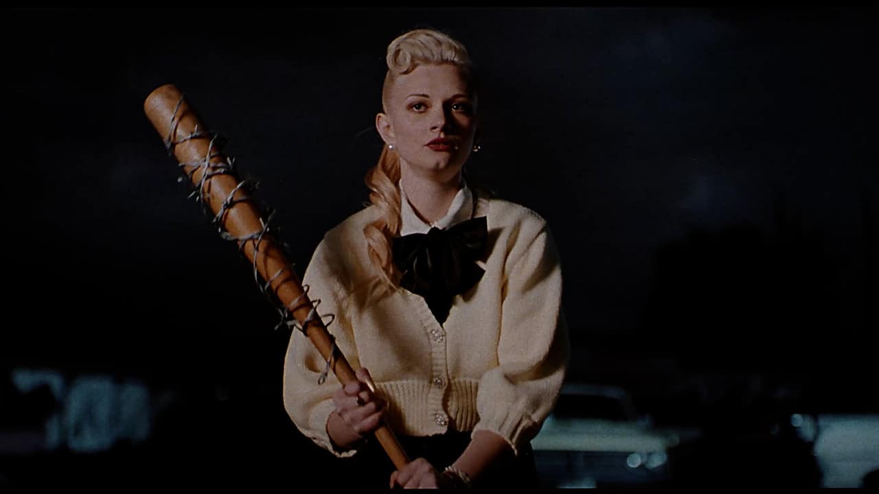 Billie (Isabella Di Rienzo) with a bat wrapped in barbed wire