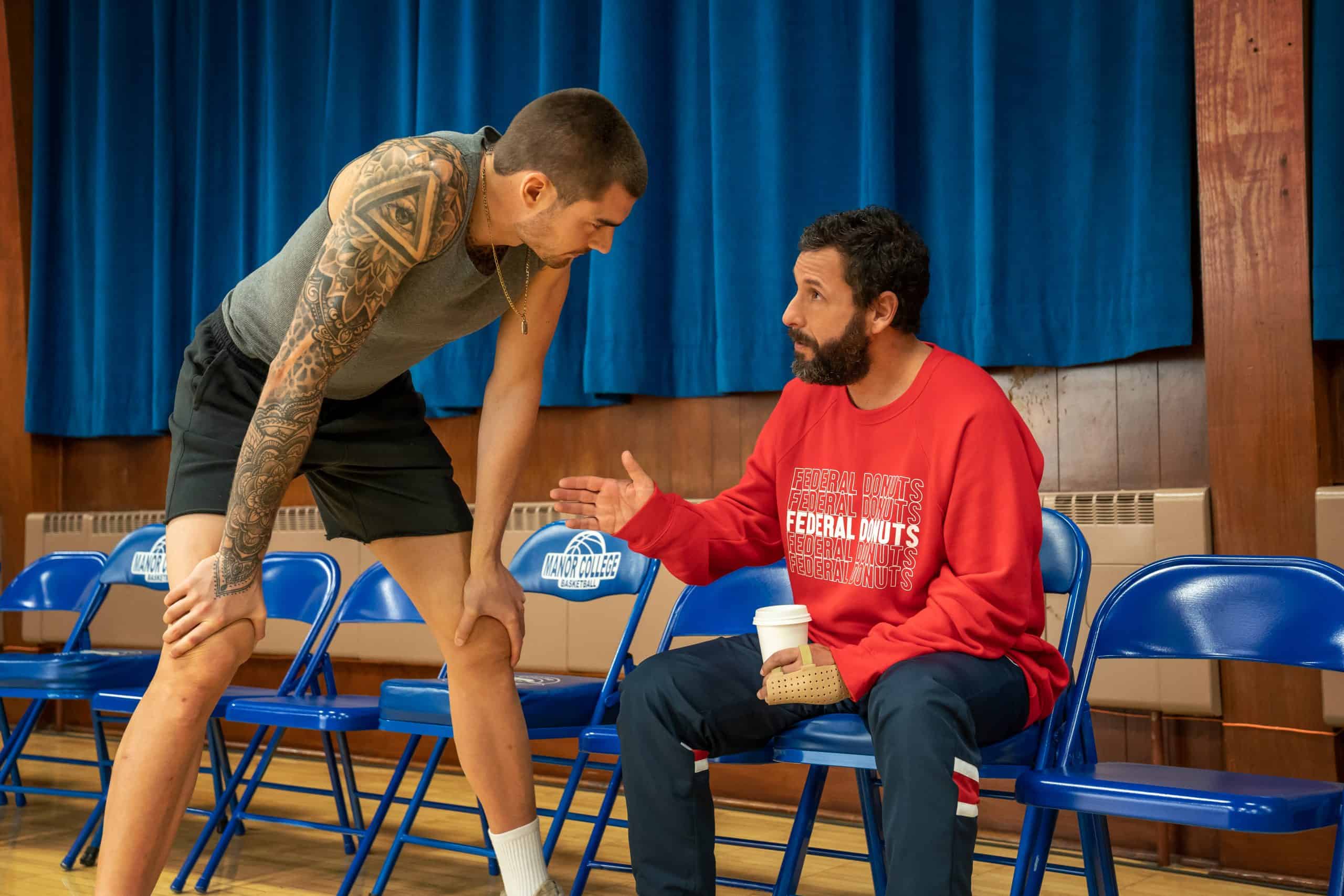 Bo (Juancho Hernangomez) and Stanley (Adam Sandler) talking before Bo plays basketball