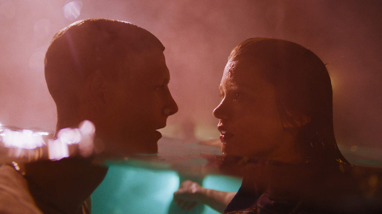 Jamie (Patrick Gibson) and Jane (Rain Spencer) in a pool together