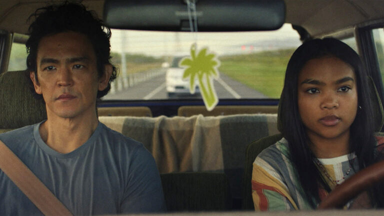 Max (John Cho) and Wally (Mia Isaac) as Wally is practicing driving