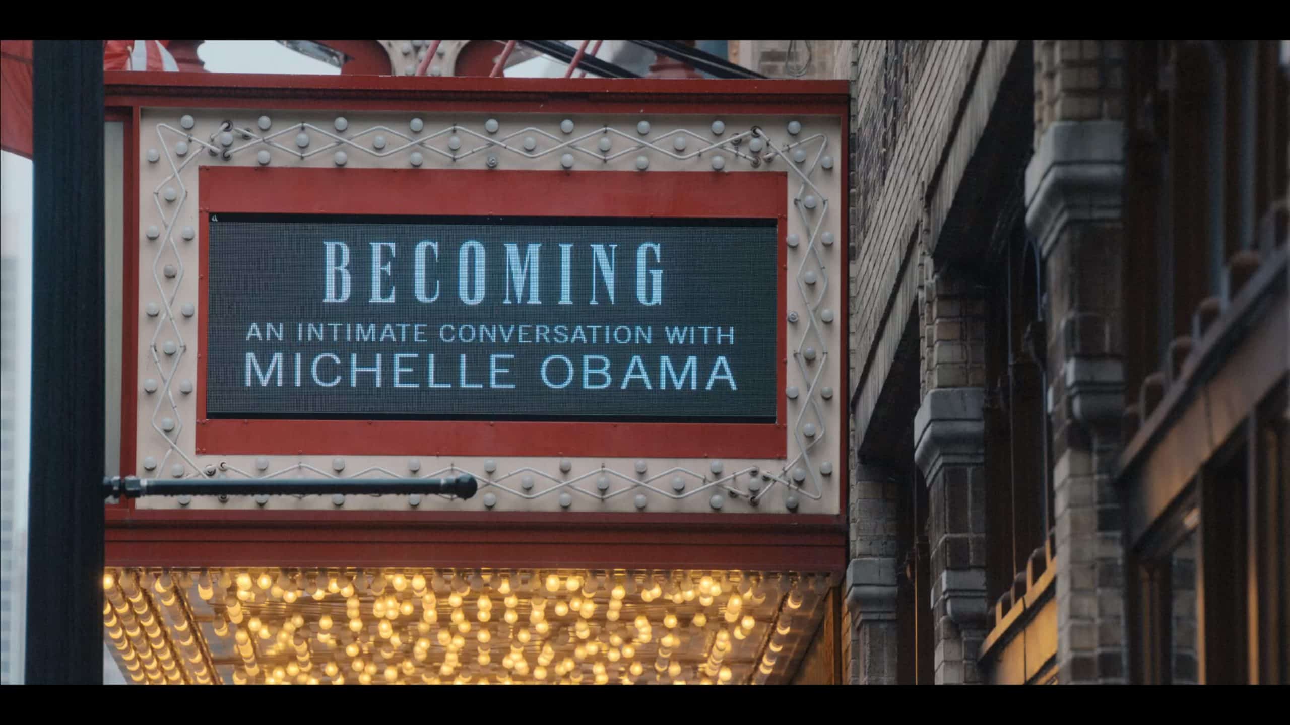 A sign advertising Michelle Obama's book "Becoming"