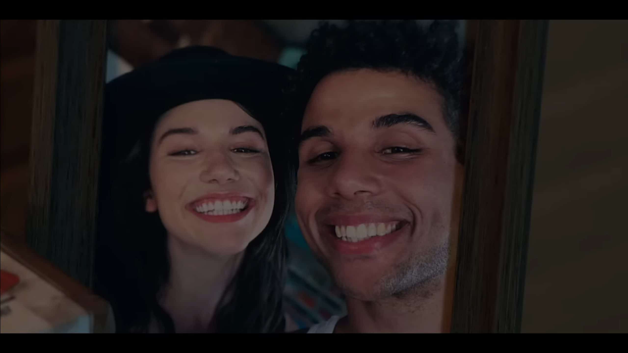 Becky (Grace Caroline Currey) and Dan (Mason Gooding) smiling in a photograph