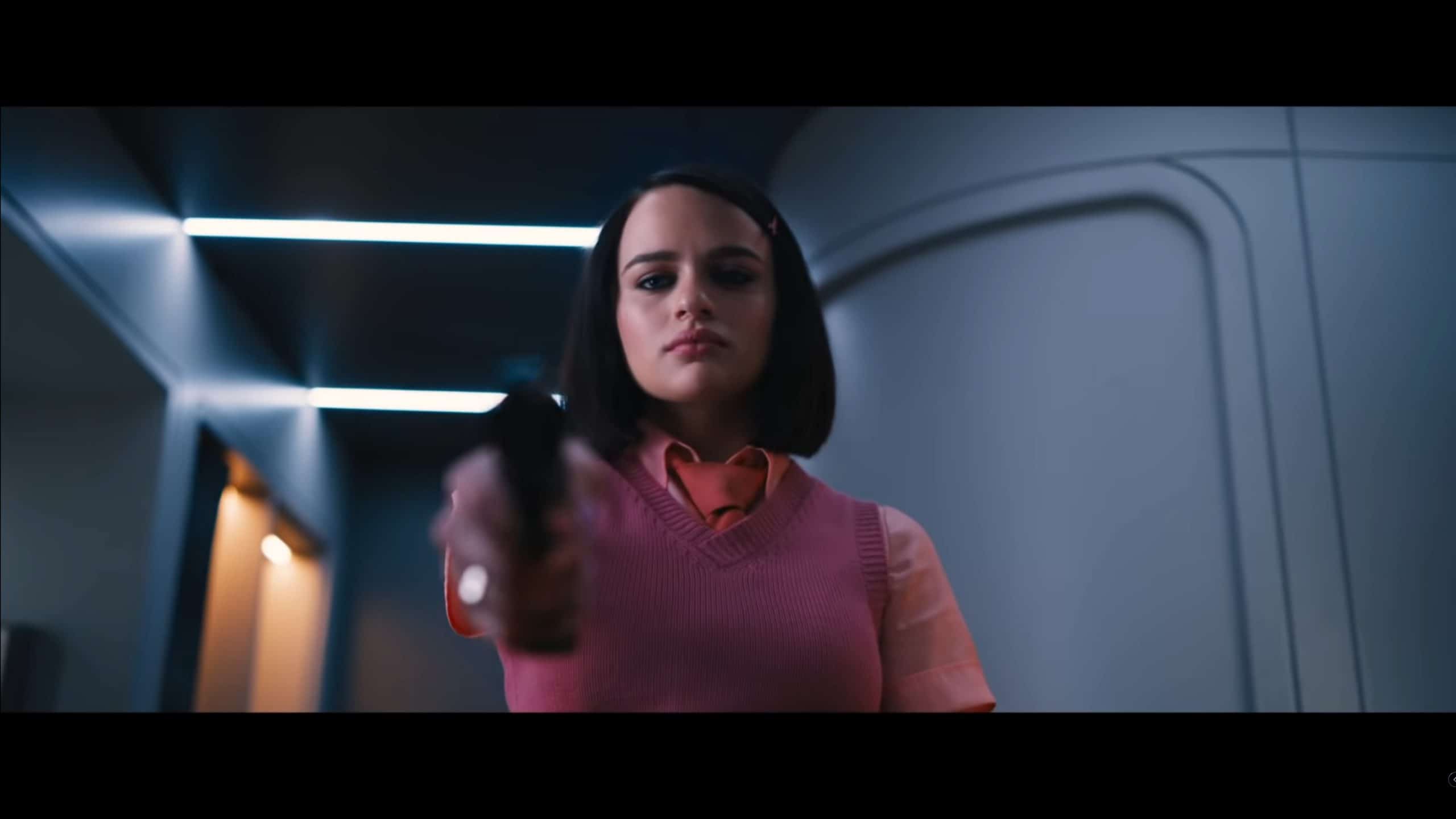 The Prince (Joey King) with a gun in hand
