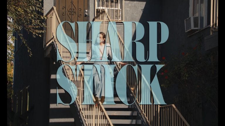 The first title card of Sharp Stick, featuring Sarah Jo going to collect rent for her mom