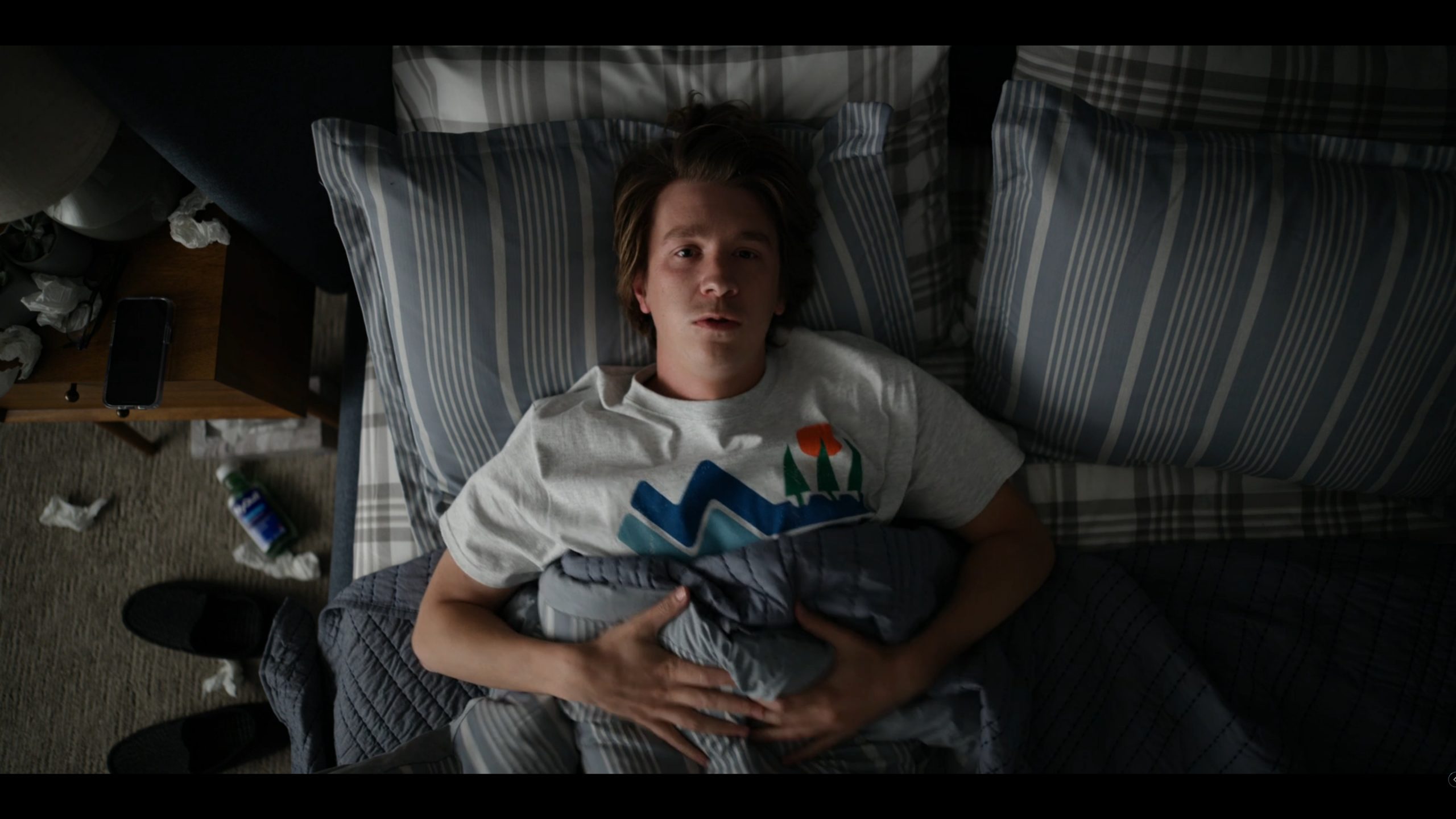 Griffin (Thomas Mann) waking up in his bed