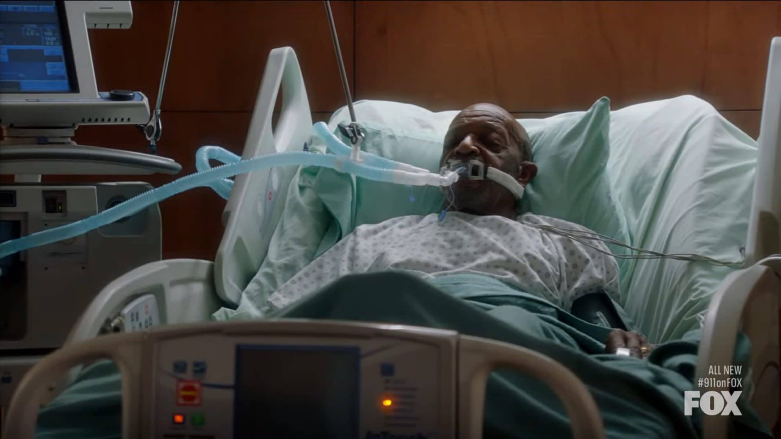 Samuel (Henry G. Sanders) in a hospital bed