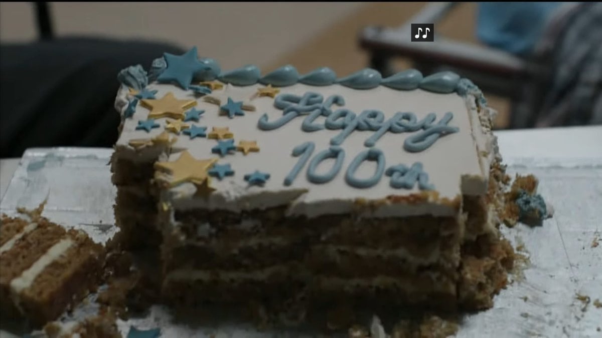 A cake celebrating a senior's birthday, but also representing this is the 100th episode of The Good Doctor