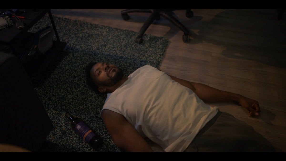 Lewis laying on the floor, after drinking