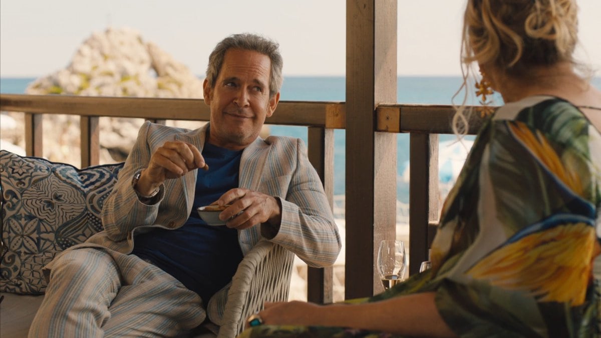 Quentin (Tom Hollander) in conversation with Tanya