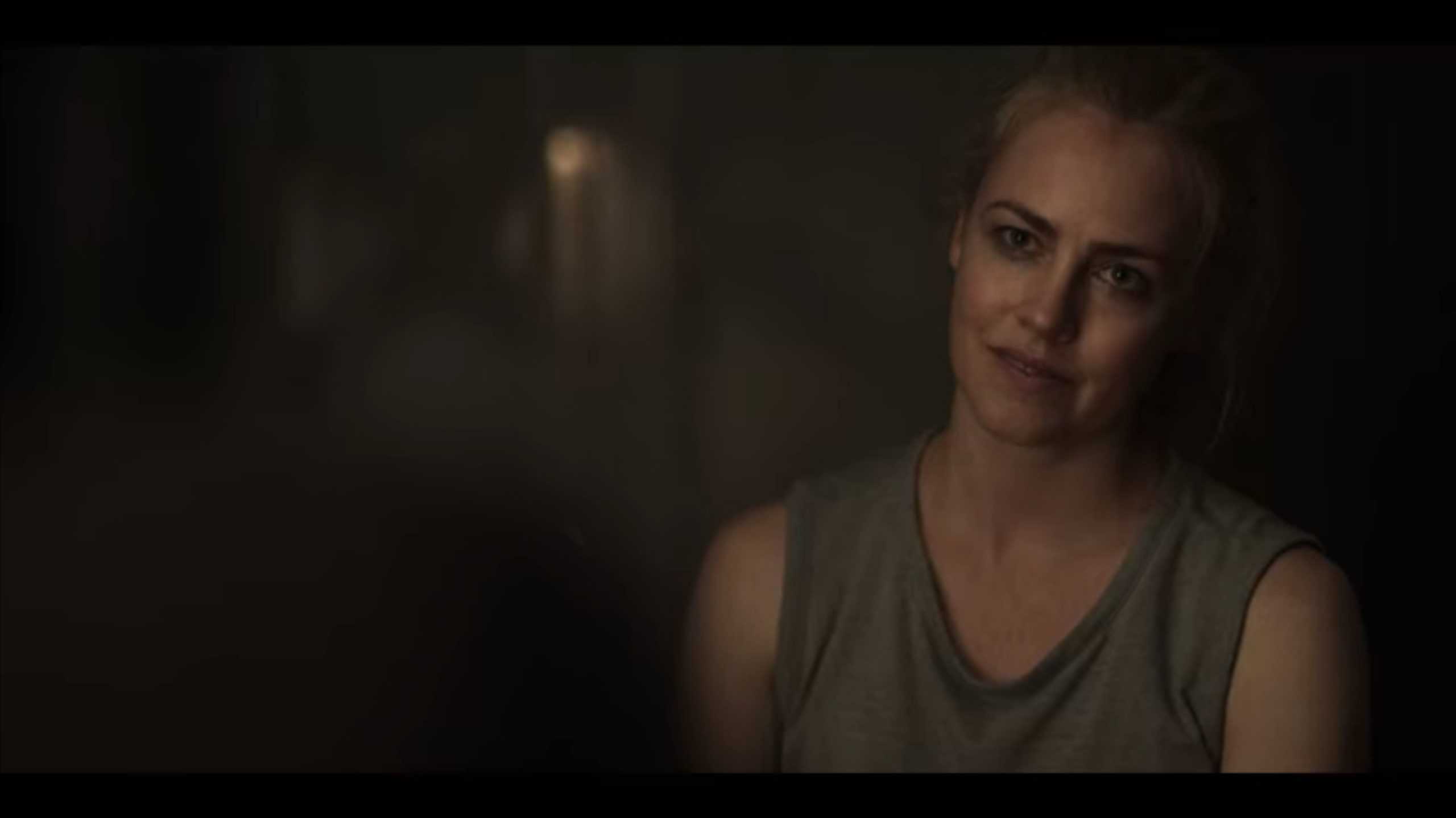 Cora (Amanda Schull) talking to Max in her hideout