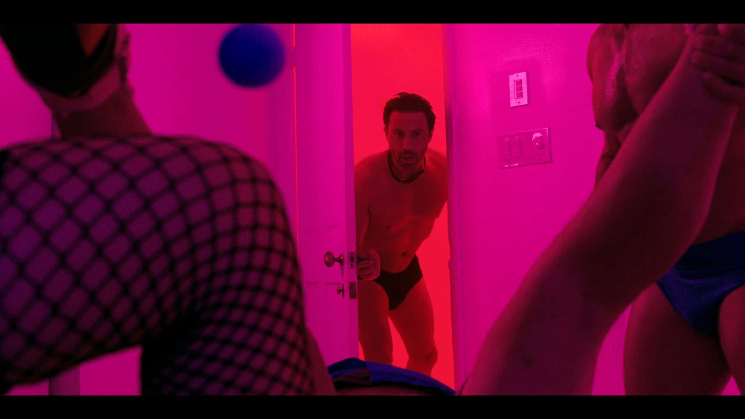 Marco Laguna (Justin Berti) trying to find his friend and leave a BDSM party
