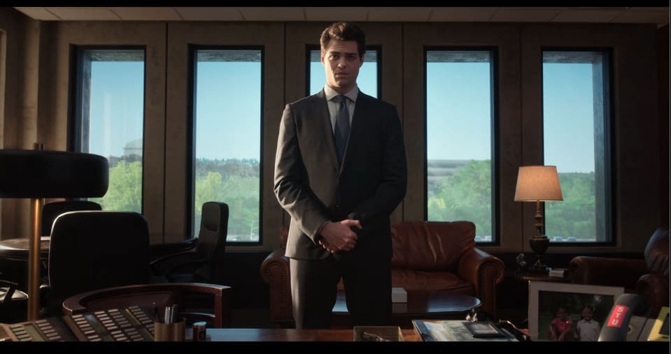 Owen Hendricks (Noah Centineo) standing in his boss' office