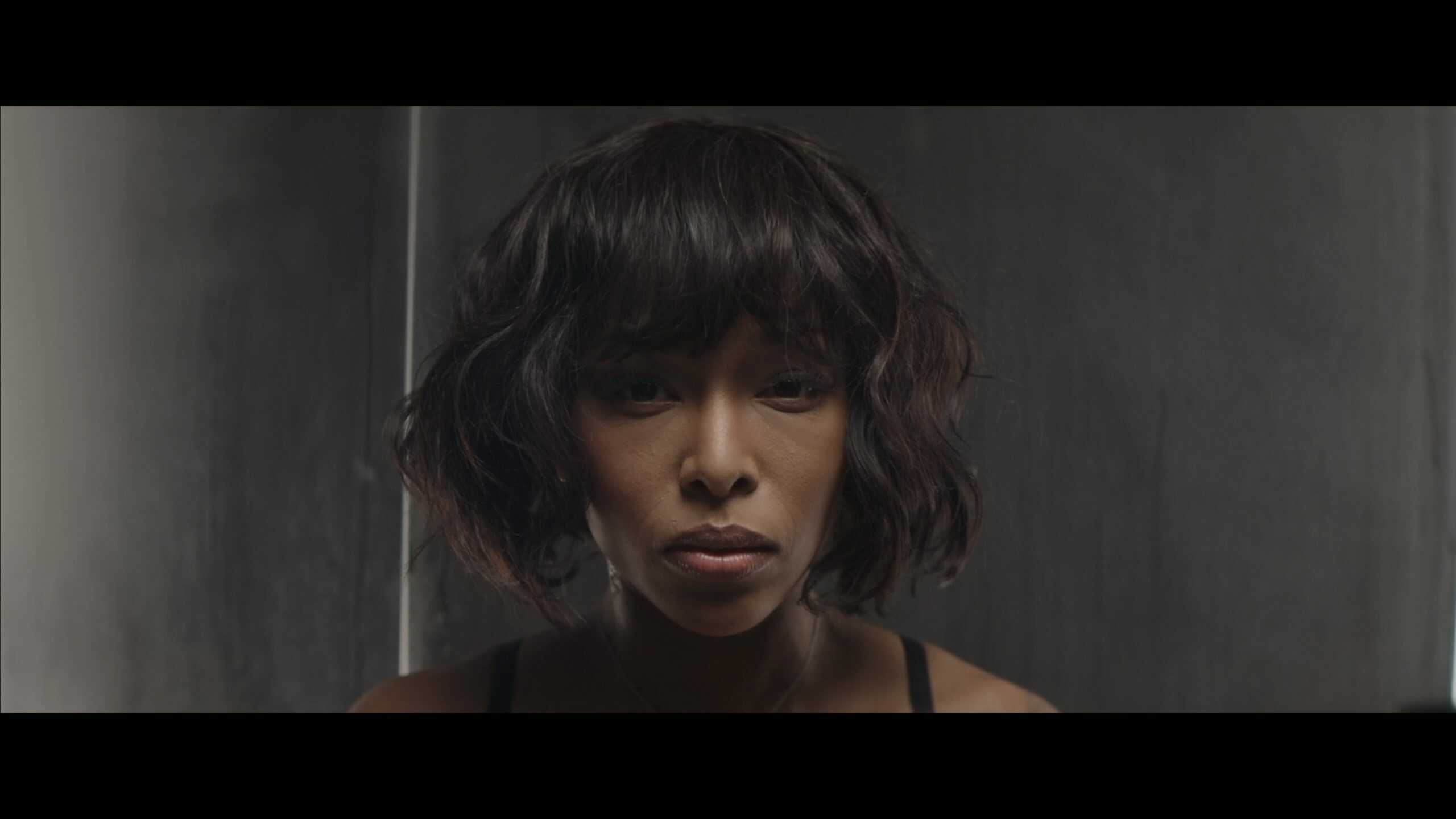 Imani Avant aka Faith Newford (Brittany S. Hall) looking in the mirror