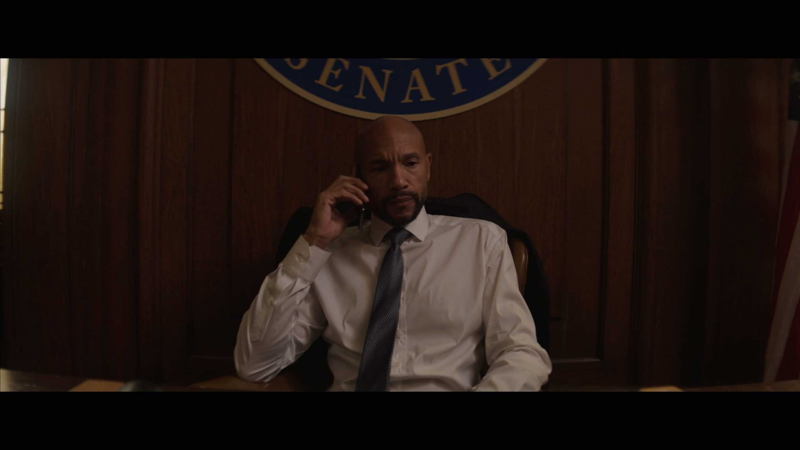 Senator Grant Powell (Stephen Bishop) getting a call from Xavier