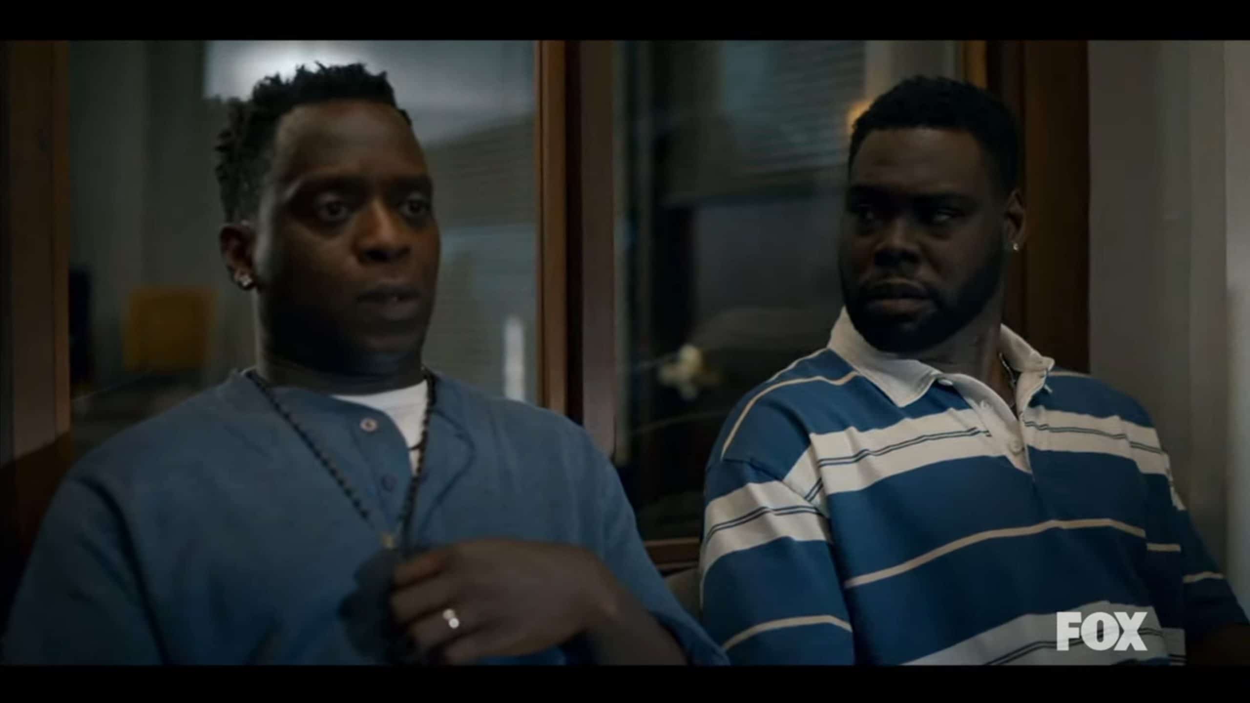 Kobna Holdbrook-Smith as David and Donald Paul as Lamar waiting to speak with the detective
