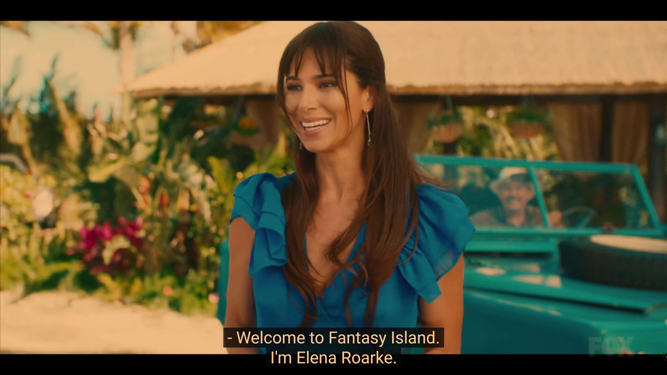 Roselyn Sanchez as Elena welcoming Joy to Fantasy Island