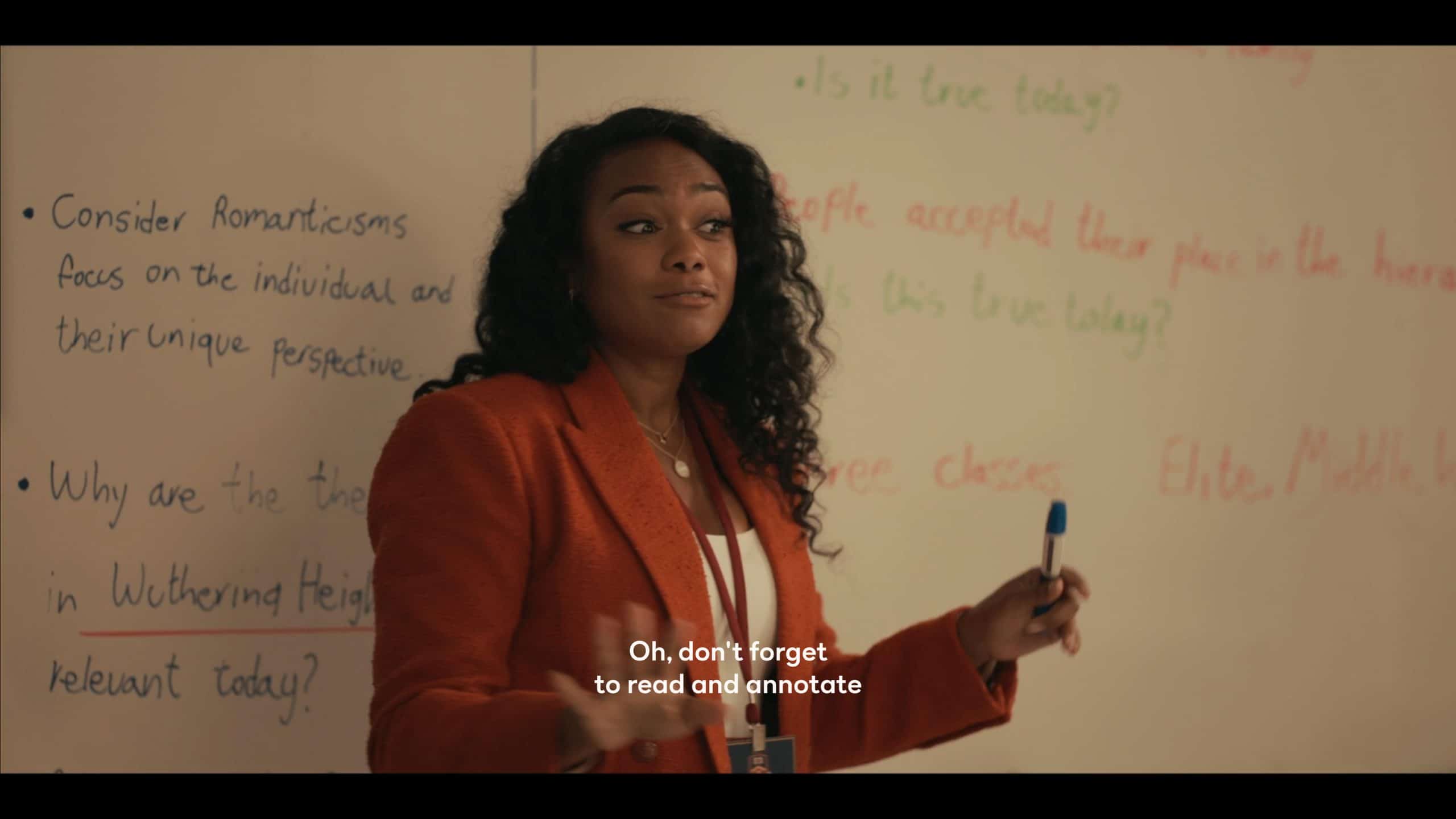 Tatyana Ali as Mrs. Hughes teaching her class which has the new Ashley in it