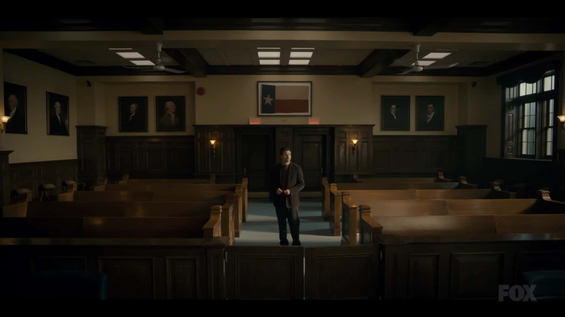 Jack (Jason Ritter) standing in a court room