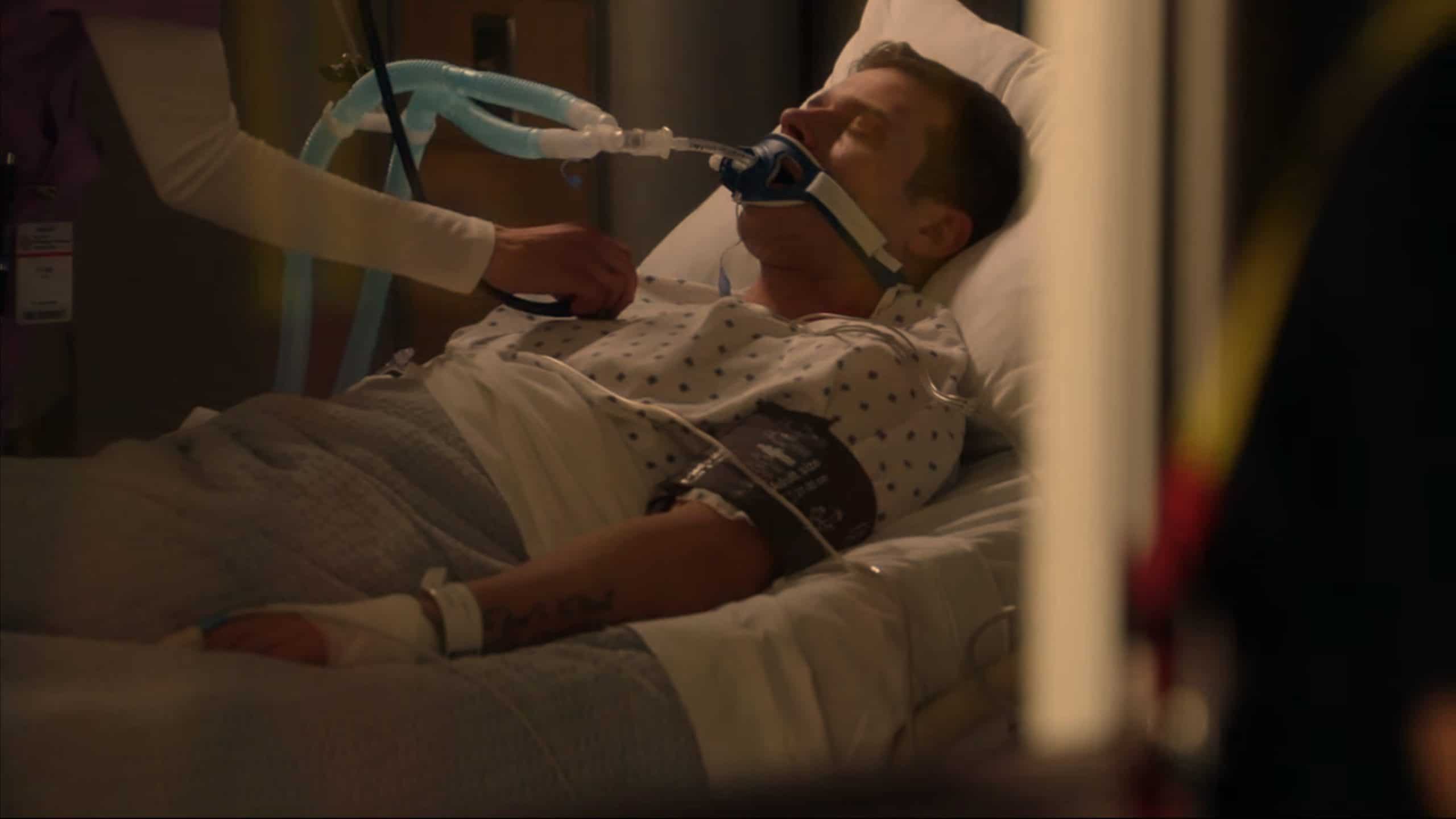 Oliver Stark as Buck in a hospital bed