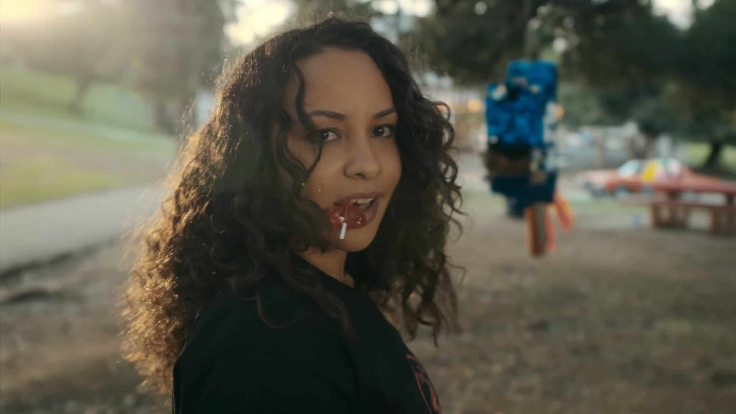 Ashley (Jasmine Cephas Jones) with a penis lollipop in her mouth