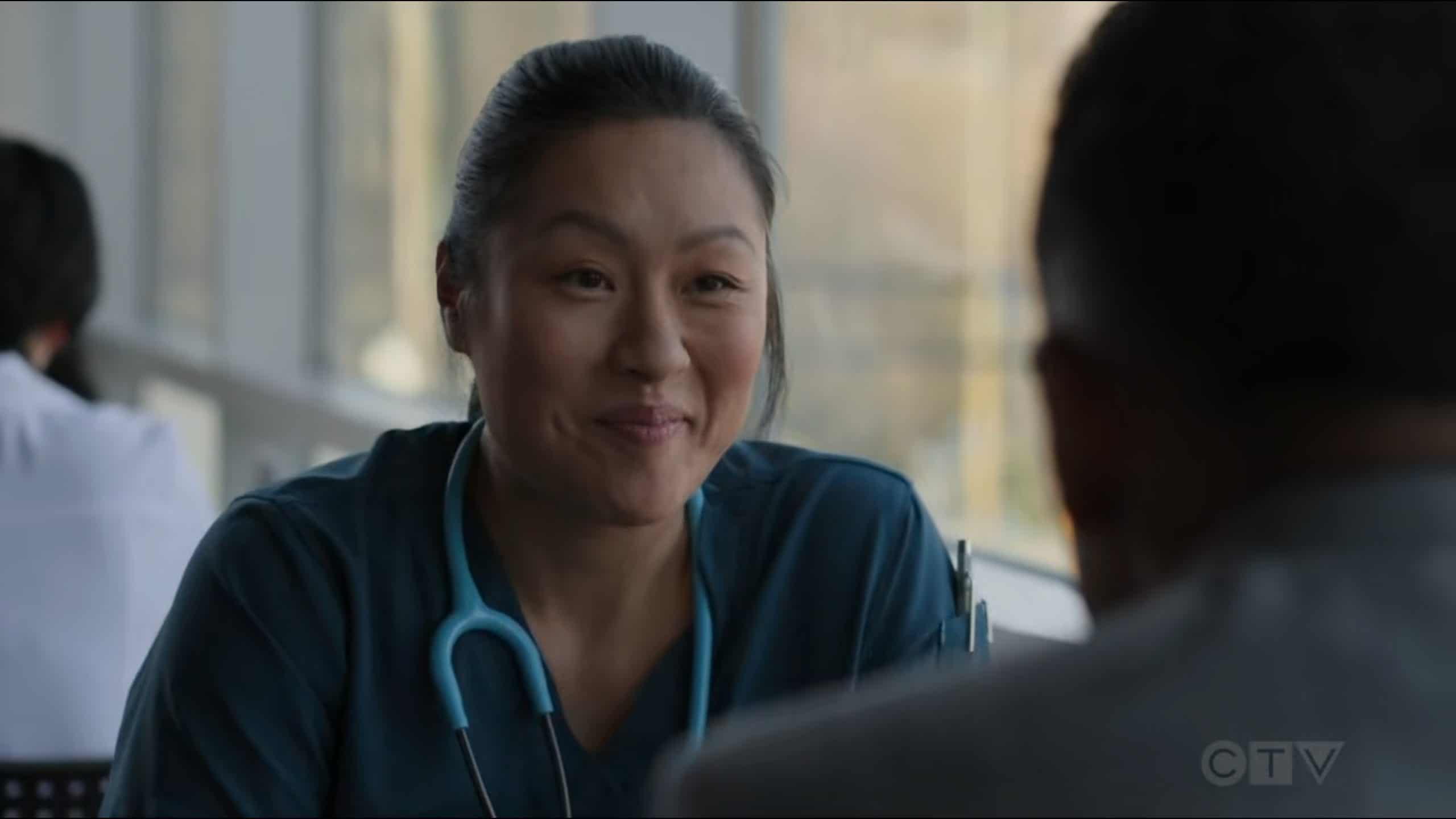 Nurse Villanueva (Elfina Luk) smiling at Dr. Andrews