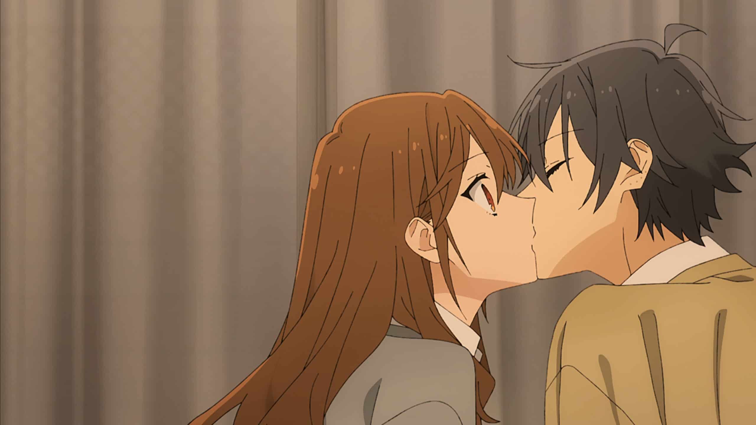 Kyouko (Haruka Tomatsu) and Izumi Miyamura (Koki Uchiyama) kissing as Izumi passes a mandarin slice into Kyouko's mouth