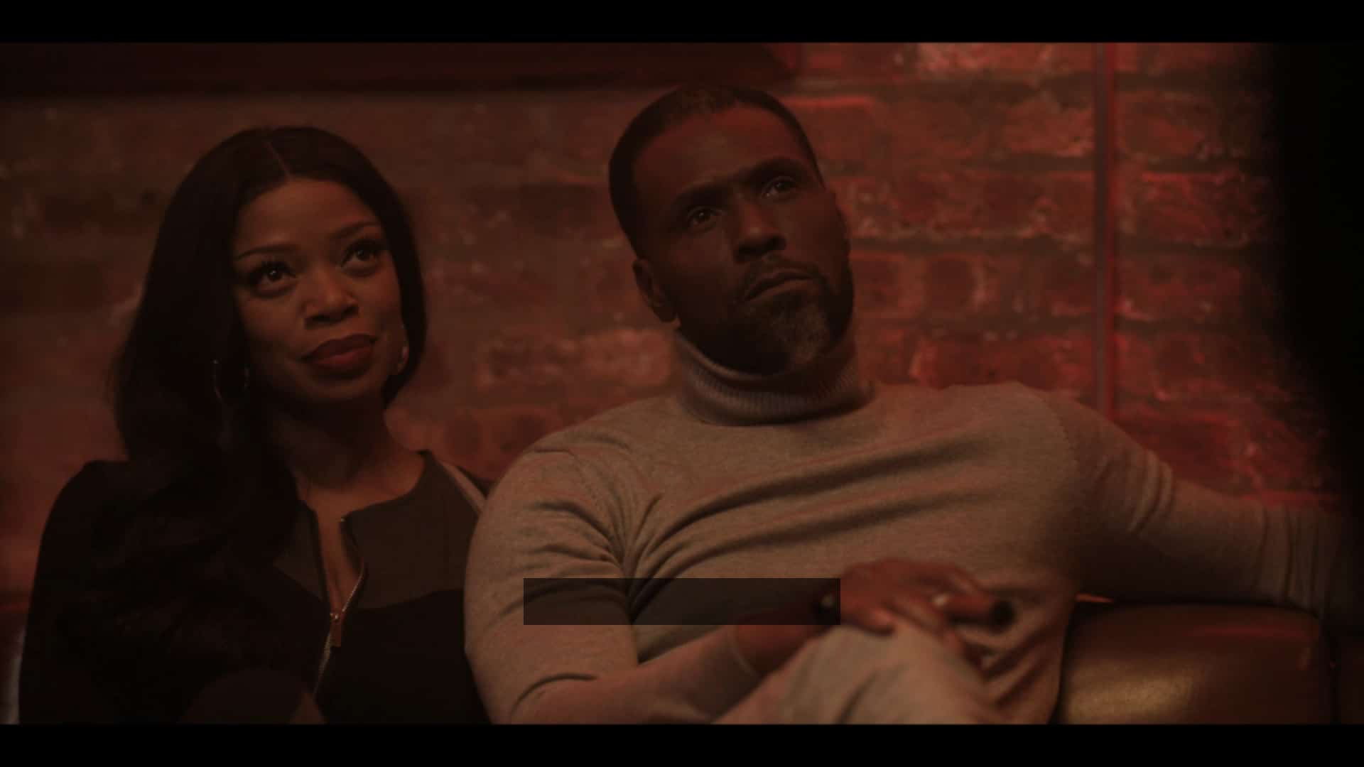 Bianca (Jill Marie Jones) and Douda (Curtiss Cook) sitting together