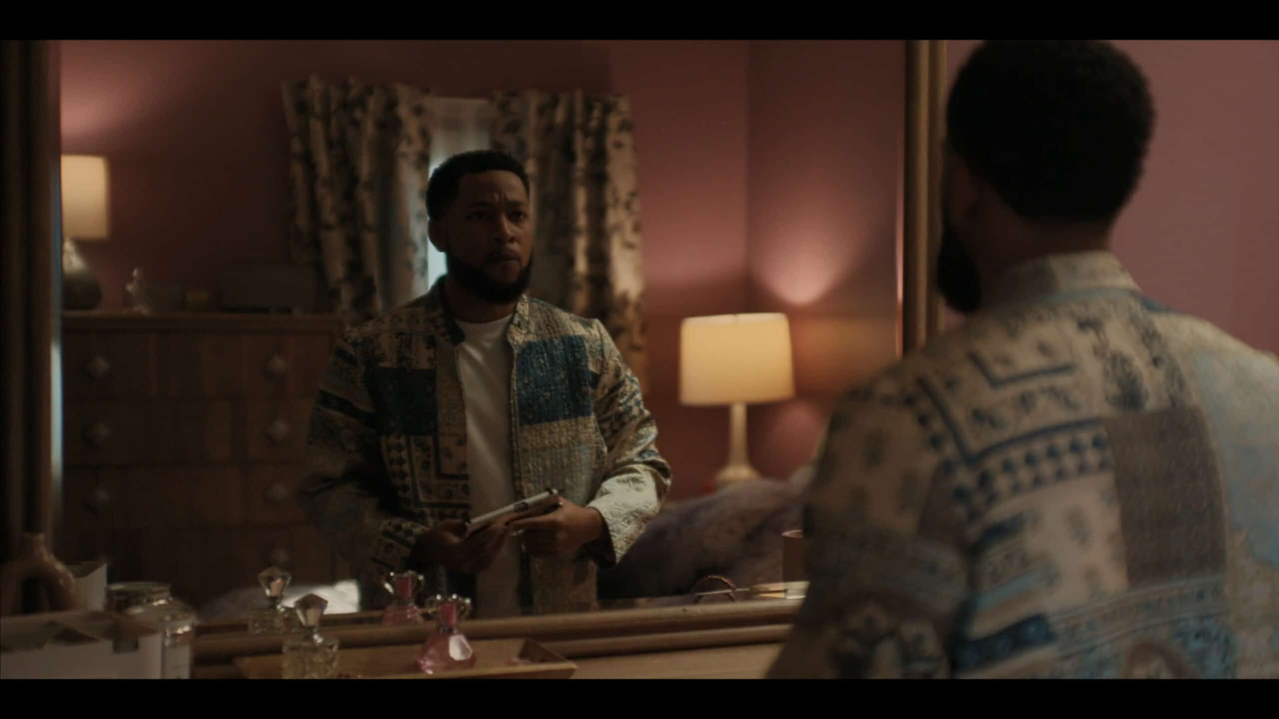 Emmett (Jacob Latimore) holding a gun Douda gave him