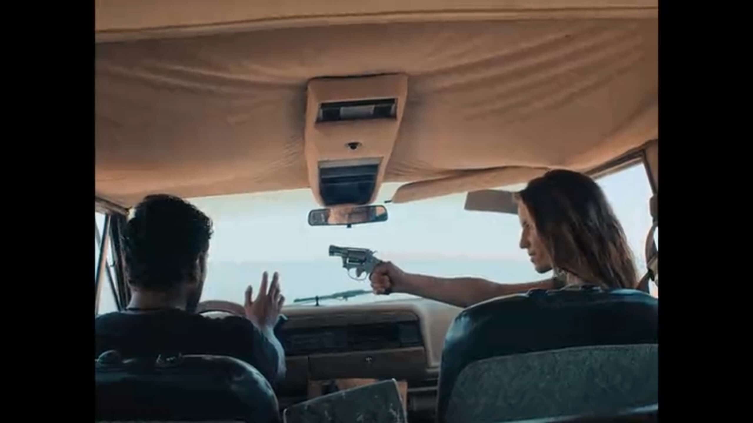 Lemuel (Tenoch Huerta) having a gun pointed at him by Sarah (Dianna Agron)