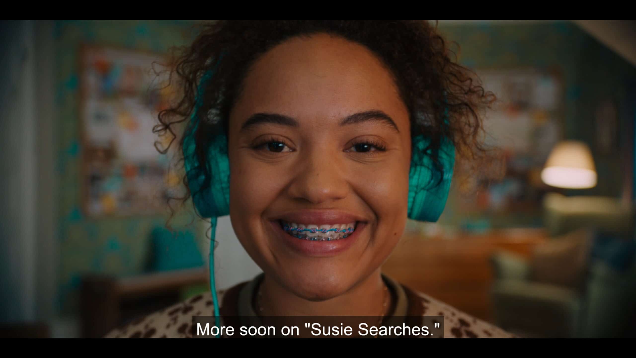 Susie (Kiersey Clemons) doing the outro to her podcast