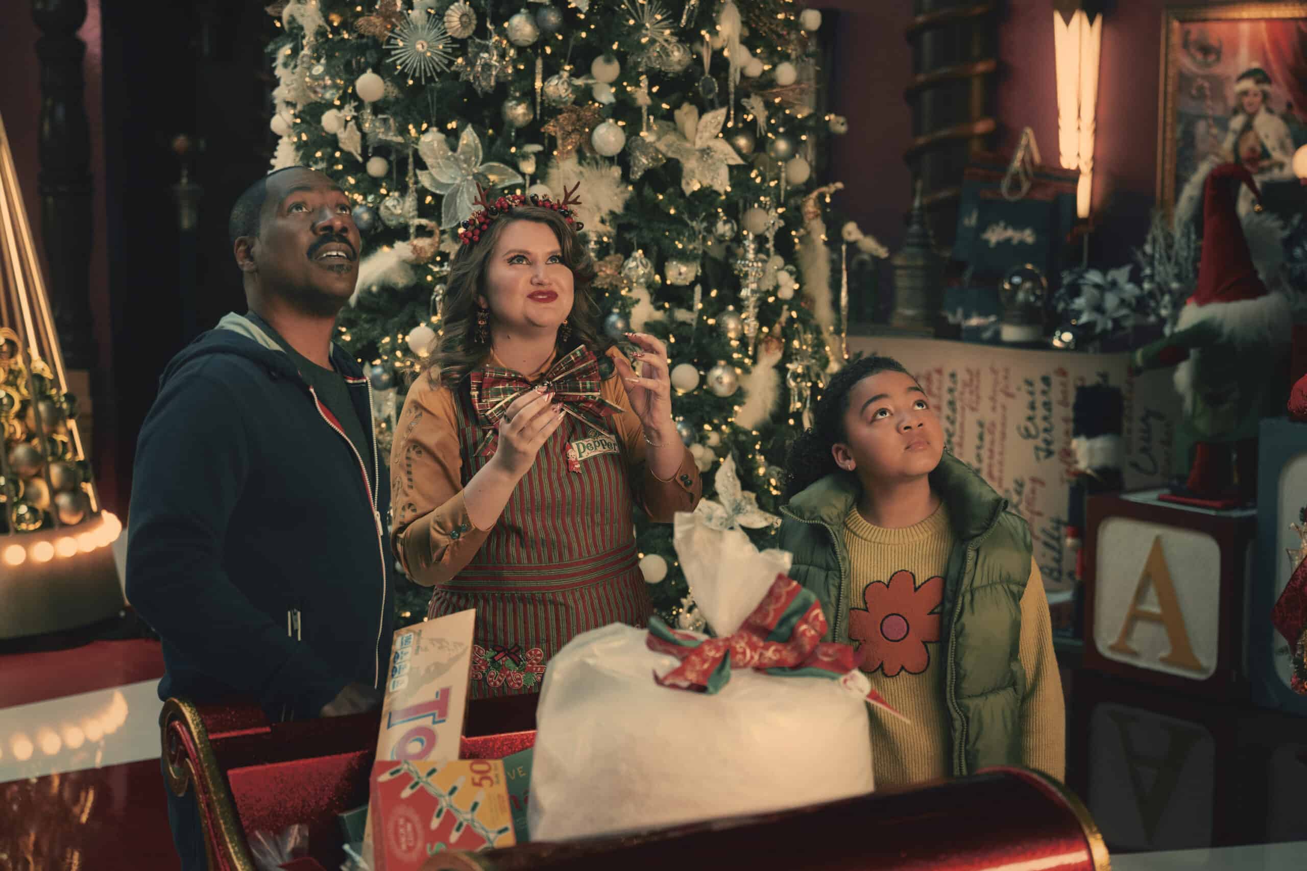 Eddie Murphy as Chris Jillian Bell as Pepper and Madison Thomas as Holly in Candy Cane Lane 2023 scaled