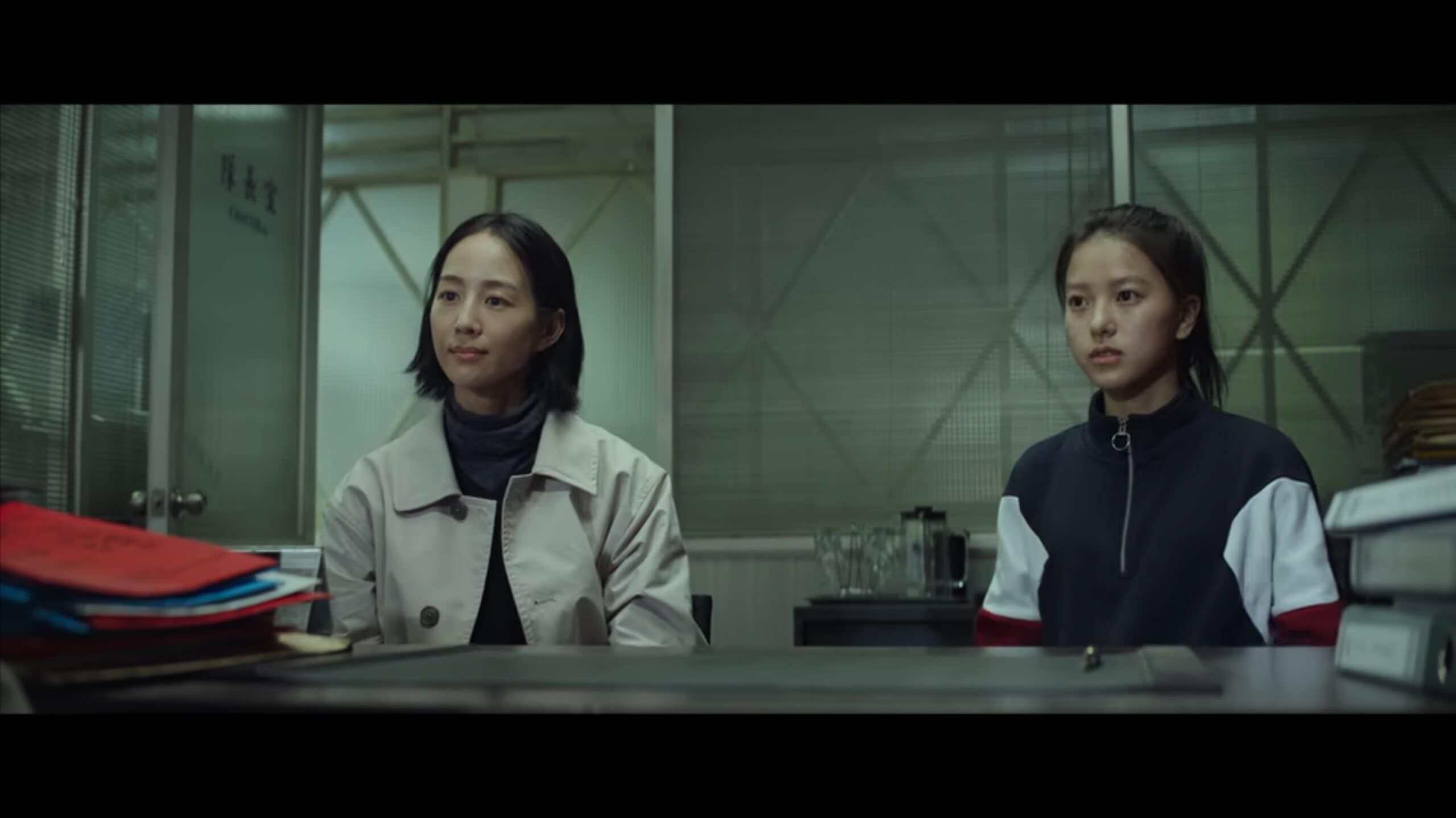 Deputy Captain Wu Chieh (Janine Chang) and Wei-shan (Chloe Xiang) as they learn they will be working together on the missing migrant case