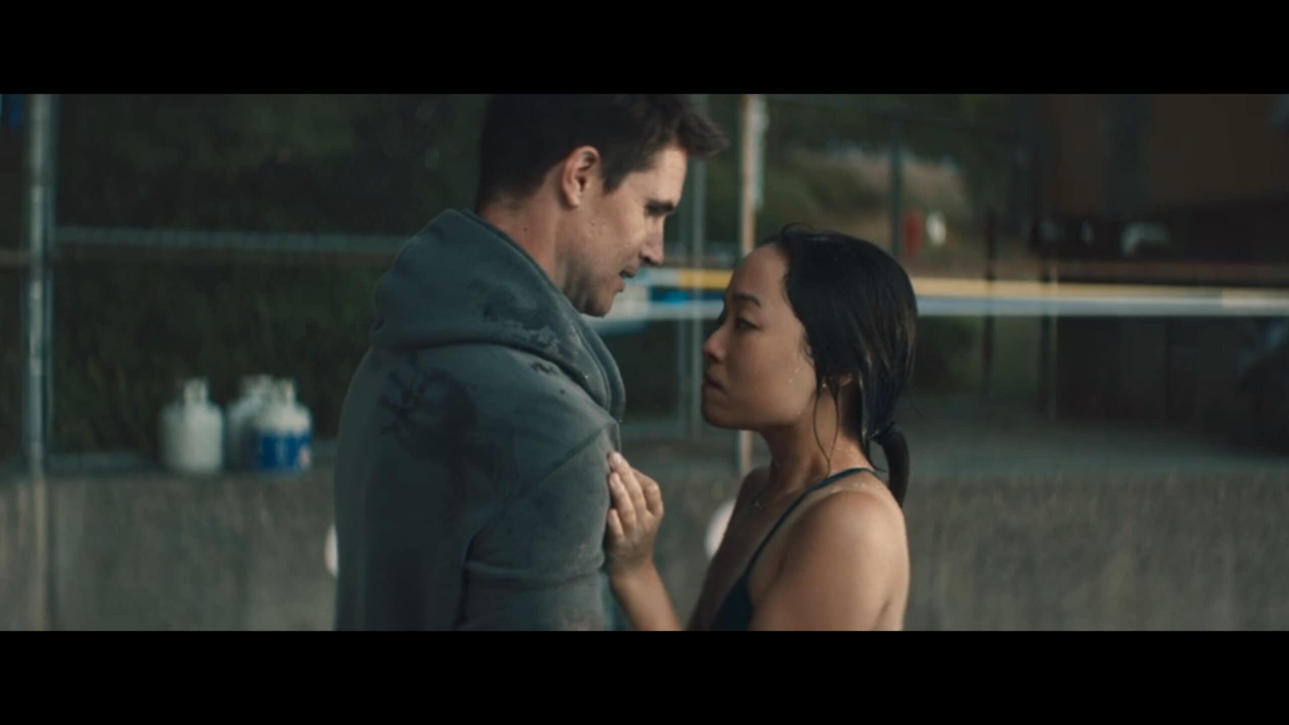 Blake (Robbie Amell) and Waverly (Andrea Bang) having a moment after a swimming lesson