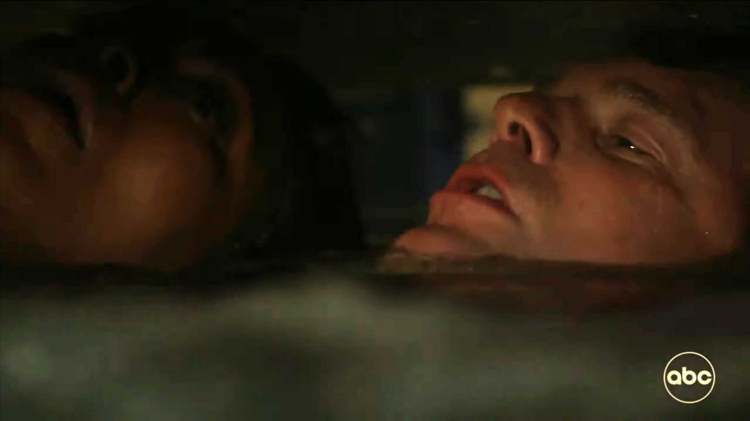 Angela Bassett as Athena and Peter Krause as Bobby drowning