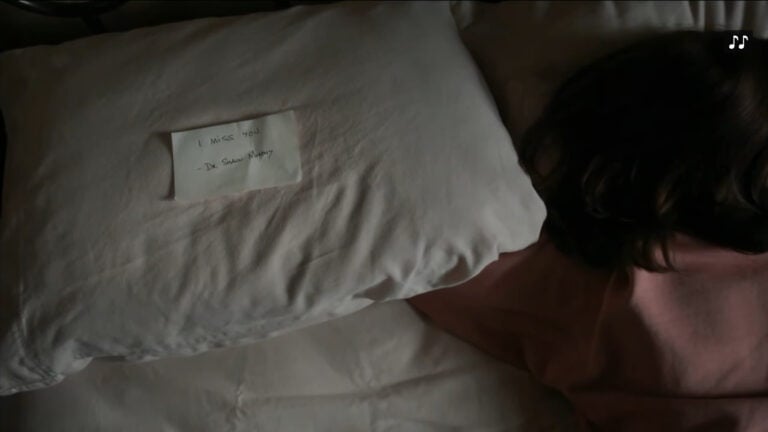 Shaun leaving a message on his pillow, noting he missed Lea